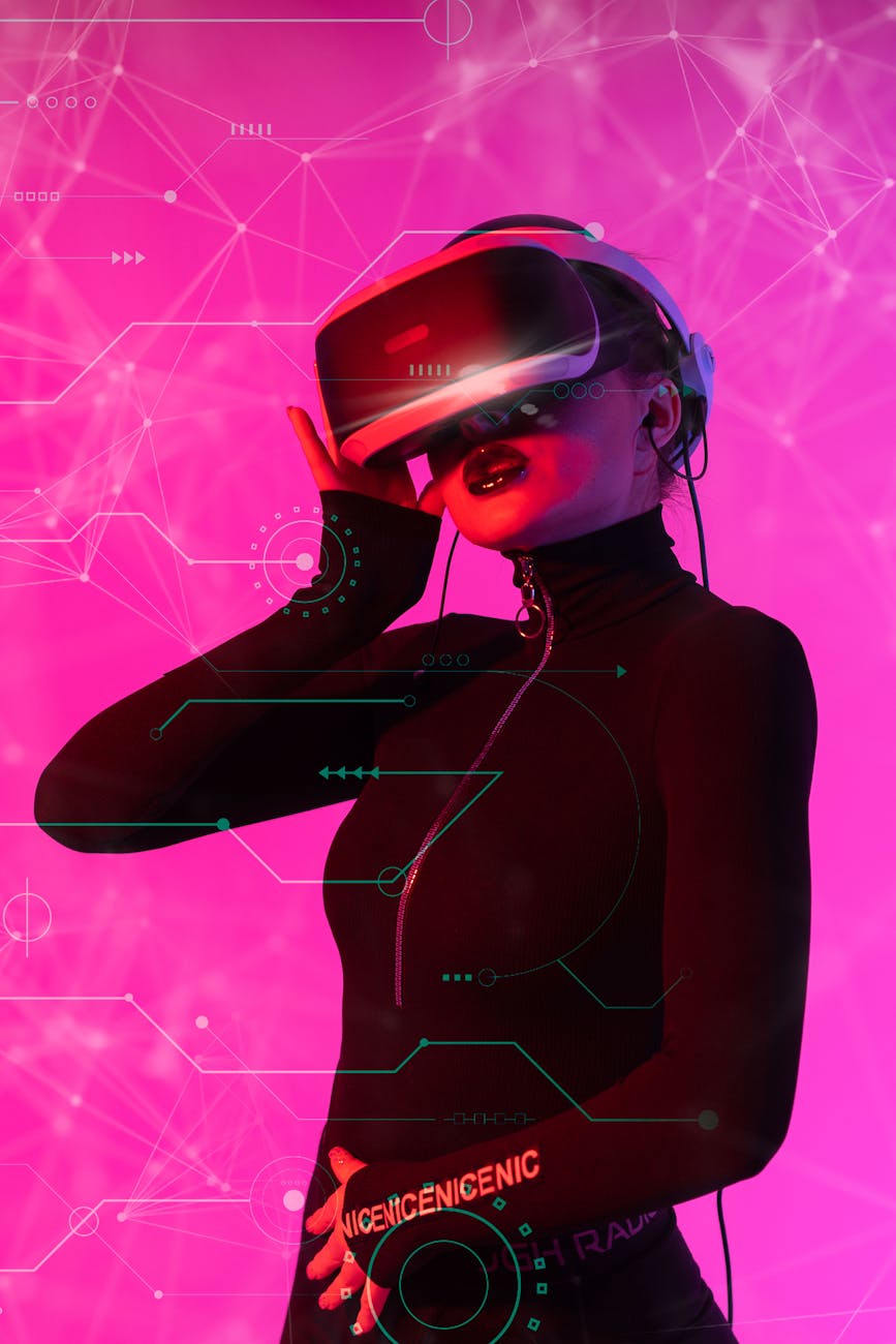 photo of a woman wearing black costume and red vr goggles against pink background