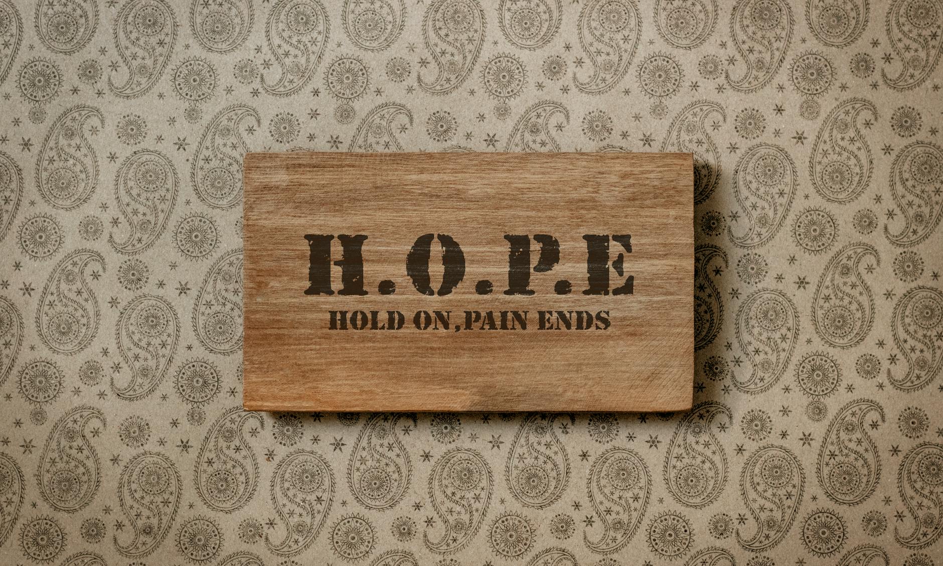 wooden tablet with text on wall