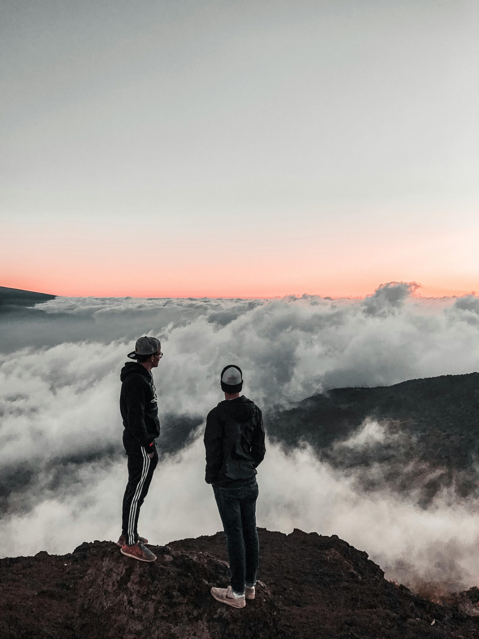 The Quiver Two men standing on top of a mountain looking at the sky The Quiver