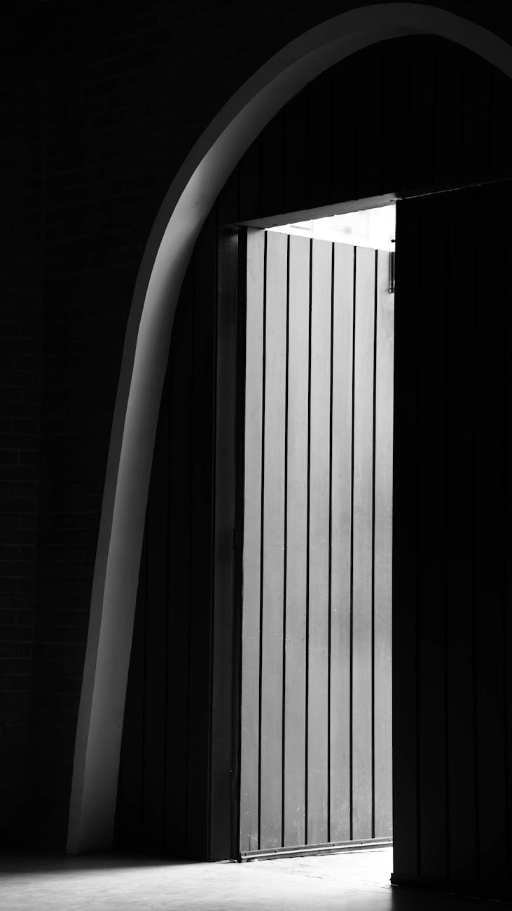 a dark room with an open door