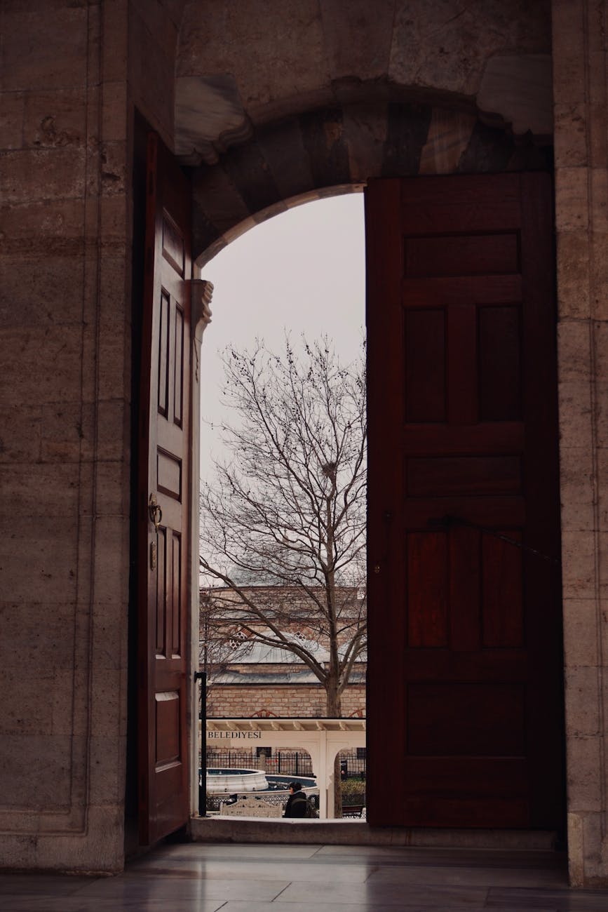 open wooden doorways to winter scene outside