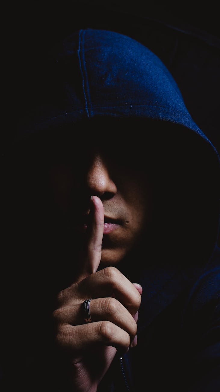 portrait of a man wearing a blue hoodie