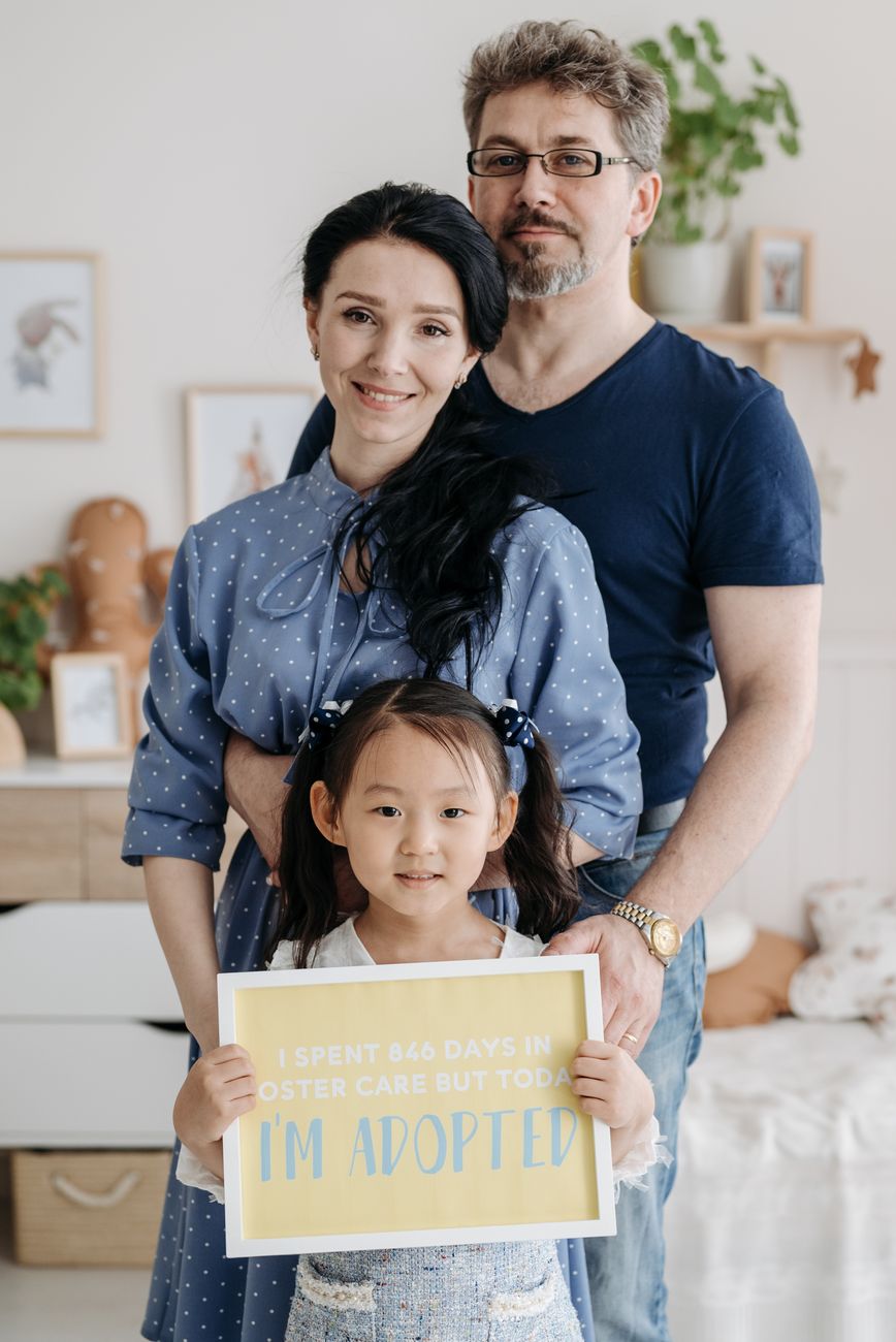 a couple together with their adopted child
